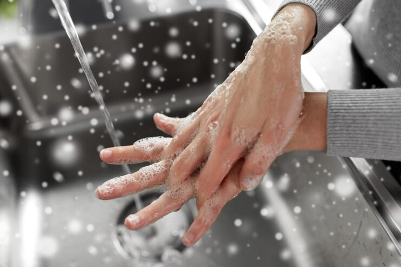 woman-washing-hands-with-soap-kitchen_380164-263505