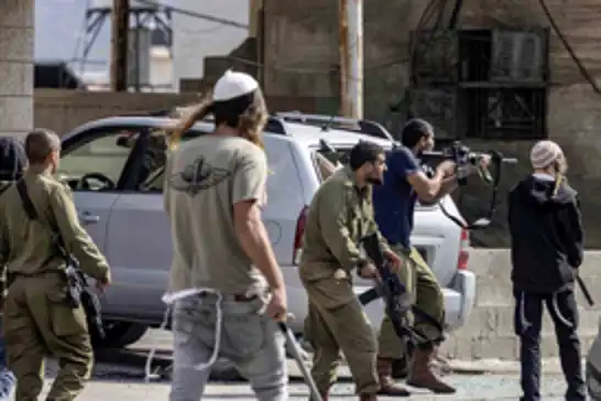 Israeli settlers attack Palestinian homes and mosque in Beit Ummar