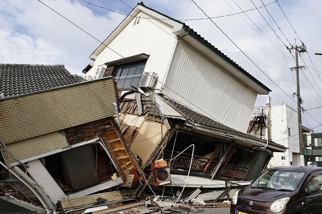 Japan earthquake kills 13 as search continues for people trapped in mall