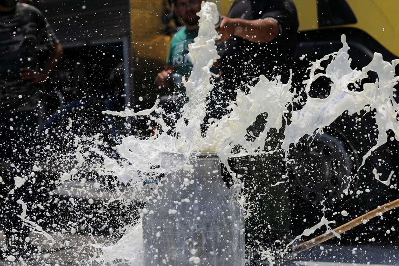 Kosovo dairy farmers dump hundreds of liters of milk in protest outside ministry