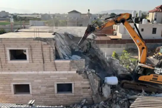 Israeli occupation forces demolish residential building housing Palestinian families in occupied East Jerusalem