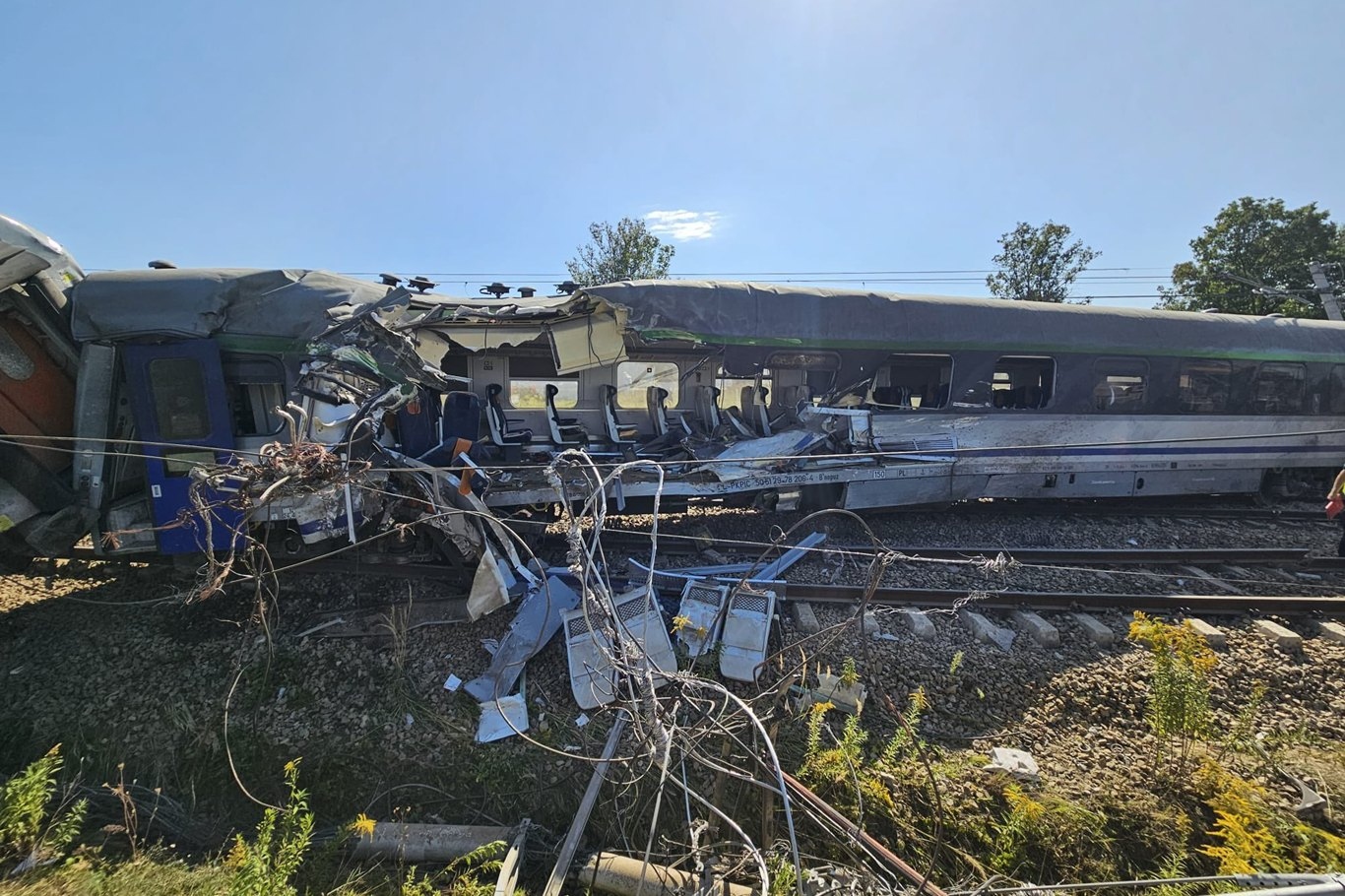 One dead, 19 injured after train collides with truck in Poland